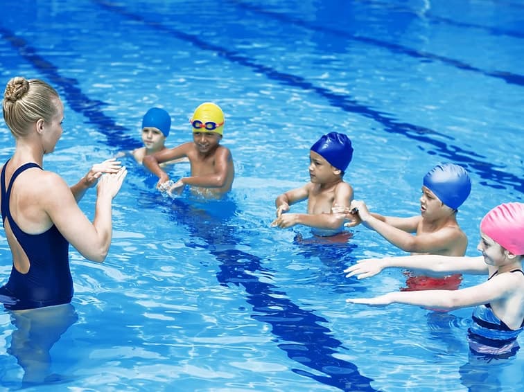 Students learning in pool